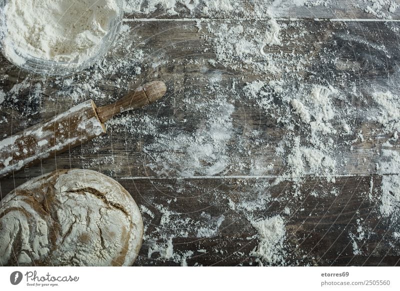 Bread and flour on a rustic wooden background. Make Kitchen Apron Flour Yeast Home-made Baking Dough Preparation Stir Ingredients Wood Neutral Background