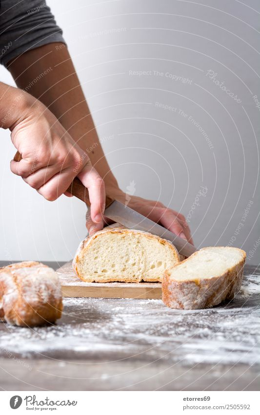 Woman cutting bread on wood Food Healthy Eating Food photograph Bread Breakfast Feminine Adults 1 Human being 30 - 45 years Work and employment Fresh