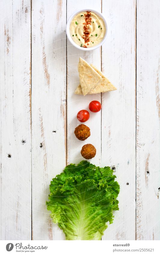 Falafel and vegetables in bowl on white wooden Food Healthy Eating Food photograph Vegetable Grain Asian Food Bowl Fresh Brown falafel Chickpeas Tomato Lettuce