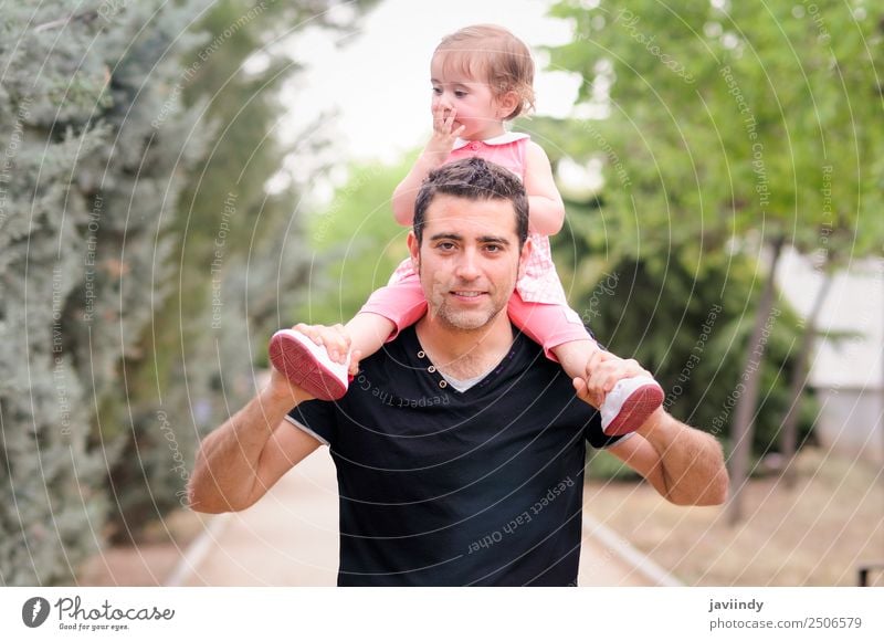 Little girl walking on the shoulders of her father in the park Parenting Child Human being Baby Toddler Girl Woman Adults Parents Father Family & Relations