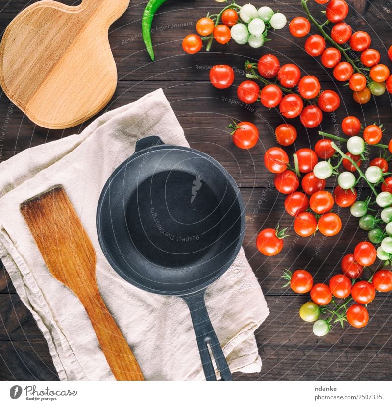 frying pan and ripe red cherry tomatoes Vegetable Vegetarian diet Pan Spoon Summer Kitchen Wood Fresh Small Natural Above Green Red Black Cherry Tomato food