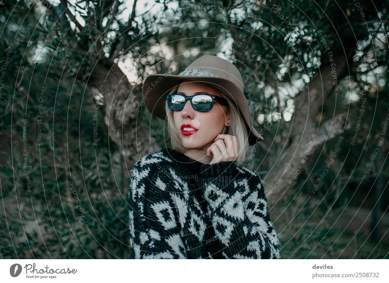 Close up portrait of blonde woman with sunglasses and a hat posing in nature Lifestyle Style Vacation & Travel Trip Adventure Mountain Human being Feminine