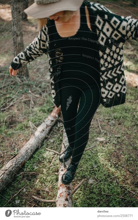 Woman in hat walking in fallen tree trunk Lifestyle Joy Leisure and hobbies Playing Trip Adventure Freedom Mountain Hiking Human being Adults 1 18 - 30 years