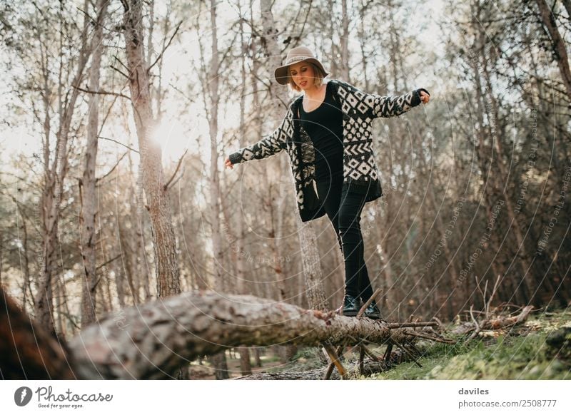 Woman walking on a fallen tree trunk Lifestyle Joy Leisure and hobbies Vacation & Travel Trip Adventure Freedom Mountain Hiking Human being Young woman