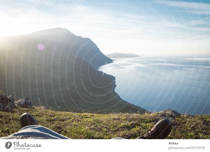 Dreaming over the Polar Sea Feet Landscape Sun Mountain Fjord Ocean Arctic Ocean Norway Hiking boots Relaxation Authentic Infinity Natural Moody Contentment