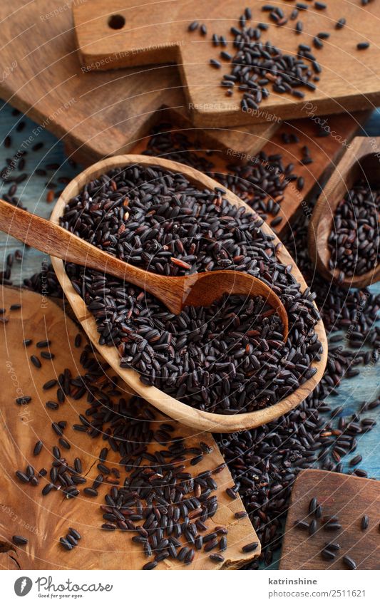 Black rice in a bowl with a spoon Vegetable Vegetarian diet Diet Spoon Table Dark Natural Wild Brown cooking food health healthy Ingredients Rustic wood dieting