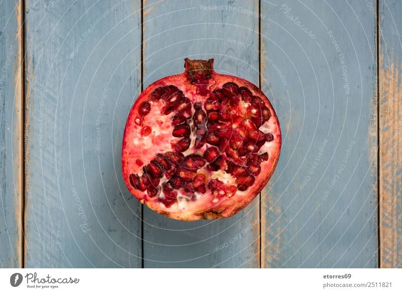 Pomegranate on blue wooden background Fruit Red Food Healthy Eating Food photograph Vegetarian diet Diet Nutrition Organic Raw Fresh Exotic Blue Wood