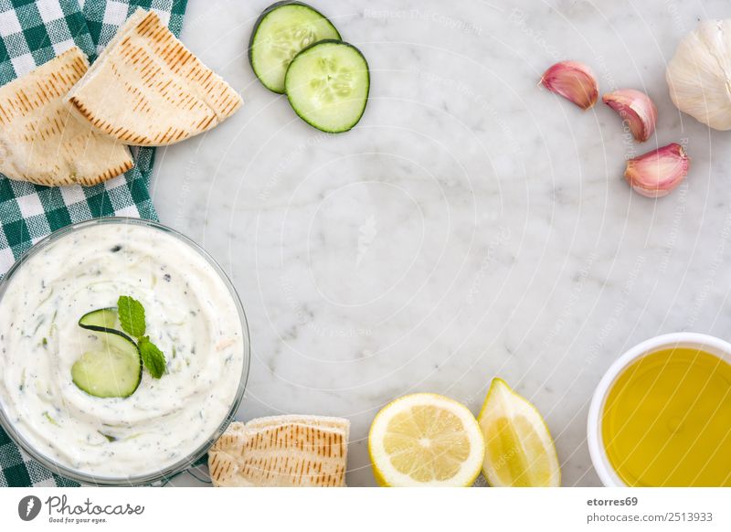 Tzatziki and ingredients Food Yoghurt Nutrition Diet Bowl Healthy Healthy Eating Wood Delicious tzatziki Sauce Cucumber Greek Marble Food photograph Dish Dip