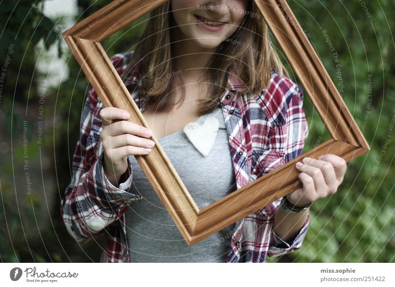 Held. Young woman Youth (Young adults) Life Shirt Piercing Heart To hold on Glittering Smiling Laughter Illuminate Happiness Happy Beautiful Warm-heartedness