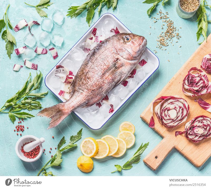 Rosa Dorado on the kitchen table with ingredients Food Fish Vegetable Lettuce Salad Herbs and spices Nutrition Lunch Dinner Organic produce Diet Crockery Style