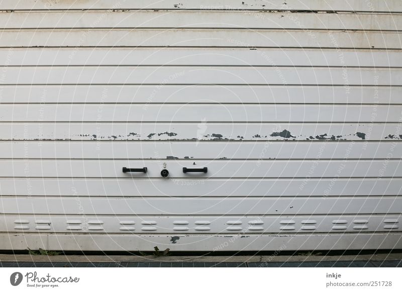 that's a garage door... Logistics Retirement Closing time Garage door Transport Door handle Lock Metal Old Dirty Broken Gloomy Gray Black White Decline Varnish