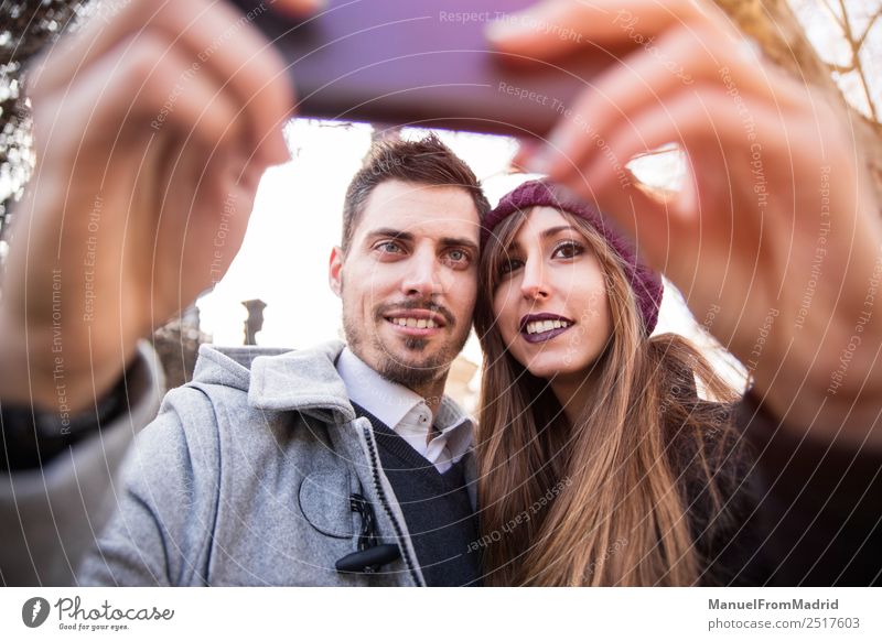 couple taking selfie in the street Lifestyle Elegant Style Joy Happy Beautiful Vacation & Travel Tourism Sightseeing Winter Telephone PDA Camera Human being