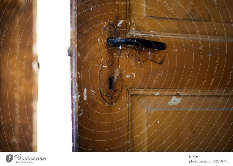 Old wooden door Door Door handle Door lock Dirty Bright Brown Black White Moody Beginning Discover Expectation Mysterious Curiosity Far-off places Decline