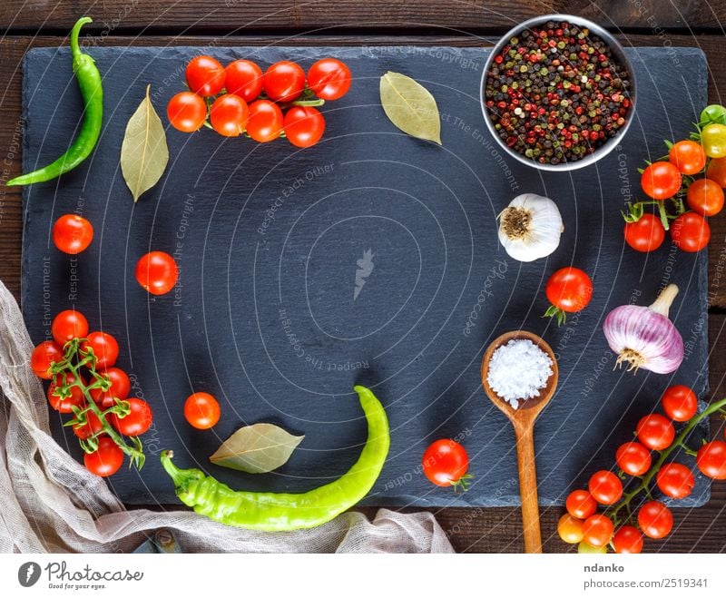 Ripe red cherry tomatoes Vegetable Dough Baked goods Herbs and spices Spoon Wood Eating Fresh Above Brown Yellow Red Black Colour Tradition food Tomato Cherry