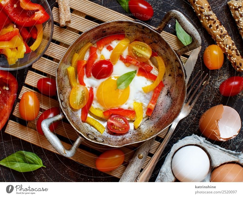 Fried egg with a bell pepper and tomatoes Vegetable Breakfast Pan Table Fresh Bright Yellow Red Cholesterol Cooking fat food Frying Fried egg sunny-side up Meal