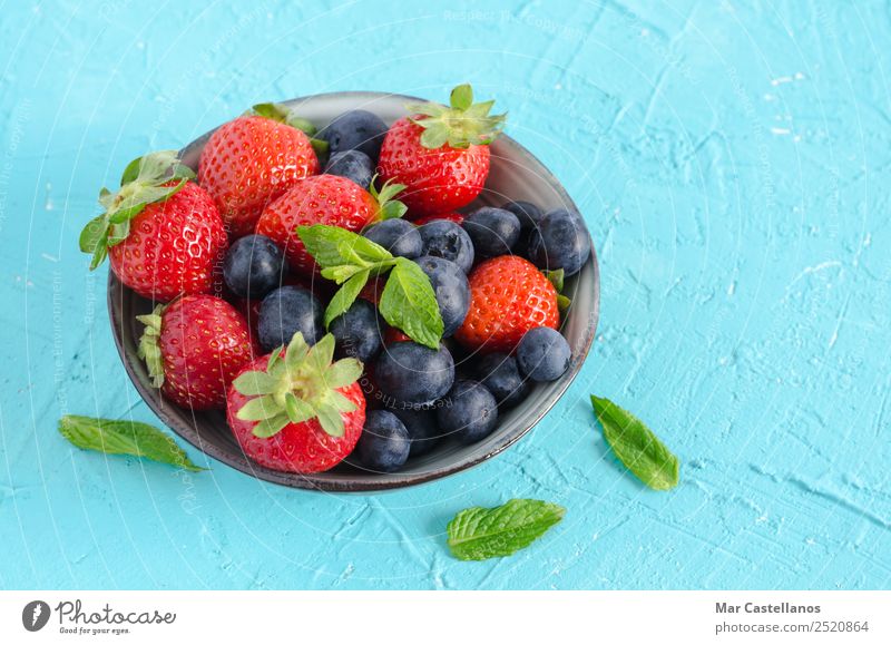 Bowl with red berries and mint leaves Fruit Dessert Nutrition Eating Vegetarian diet Diet Beverage Juice Well-being Summer Table Nature Spring Plant