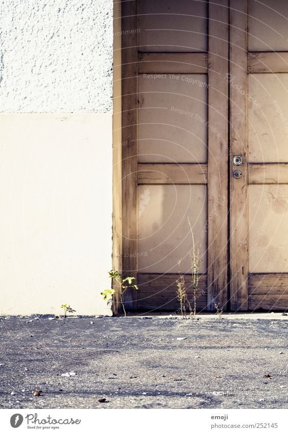 doormen House (Residential Structure) Industrial plant Building Wall (barrier) Wall (building) Facade Door Old Ground Colour photo Exterior shot Copy Space left