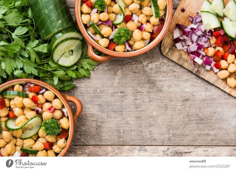 Chickpea salad in brown bowl on wood Chickpeas Salad Cucumber Onion Broccoli Vegetable Vegan diet Vegetarian diet Pepper White Healthy Healthy Eating Diet Fresh