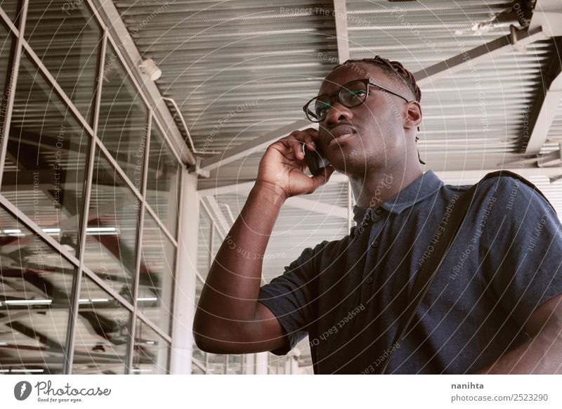 Young businessman in a station Student Work and employment Profession Office work To talk Telephone Cellphone Technology Human being Masculine Young man