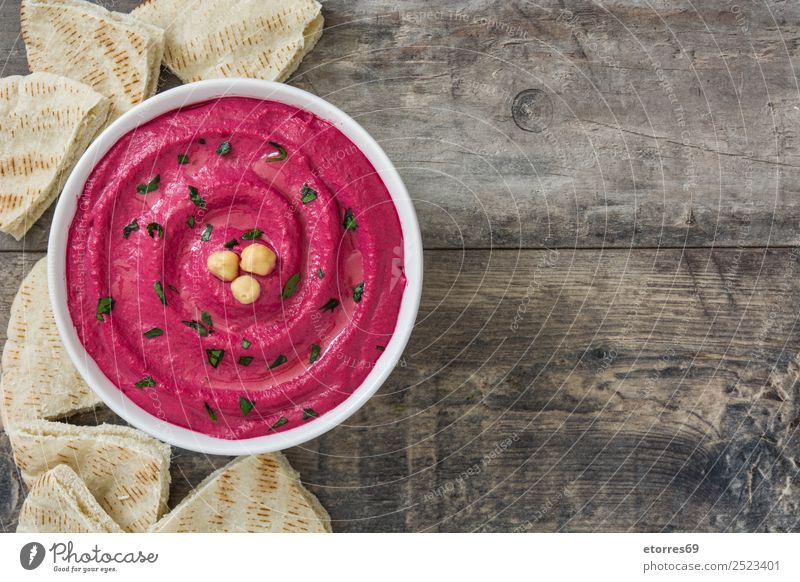 Beet hummus in bowl and pita bread Food Bread Nutrition Vegetarian diet Diet Bowl Healthy Eating Table Wood Fresh Red beet Dish Food photograph Lemon Coriander