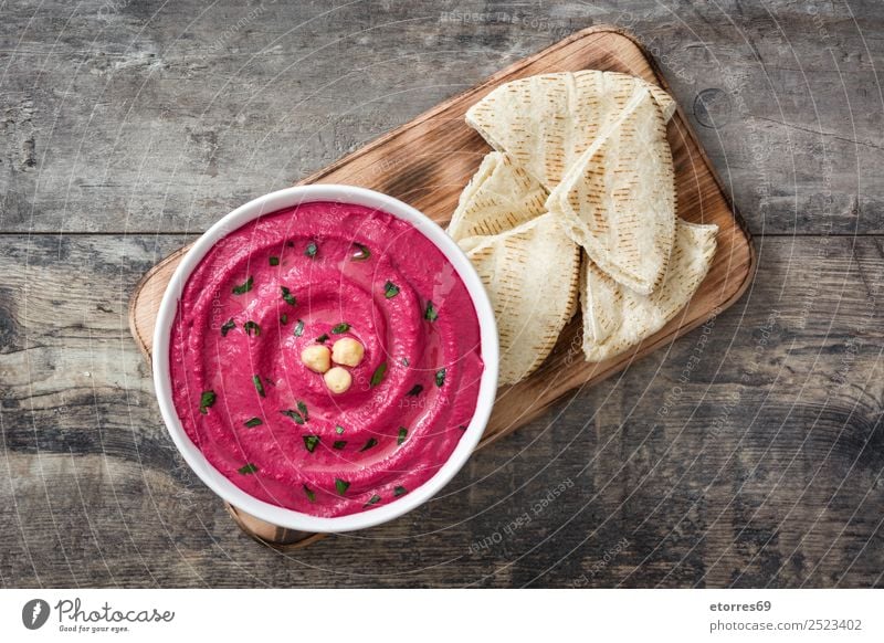 Beet hummus in bowl and pita bread on wood Food Bread Nutrition Vegetarian diet Diet Bowl Healthy Eating Table Wood Fresh Red beet Dish Food photograph Lemon