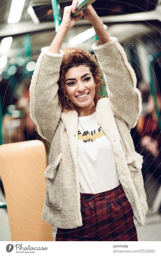 Smiling arabic woman inside subway train. Lifestyle Beautiful Hair and hairstyles Vacation & Travel Tourism Trip Human being Young woman Youth (Young adults)