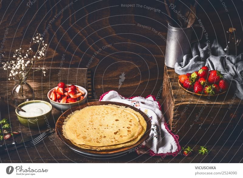 Pancakes on rustic kitchen table with strawberries Food Fruit Dessert Breakfast Organic produce Vegetarian diet Diet Crockery Plate Bowl Cutlery Style Design