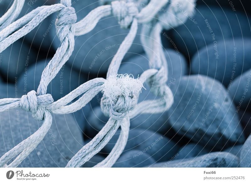 flotsam and jetsam Environment Summer Coast Bay Deserted Stone Plastic Knot Net Network Movement Relaxation Firm Broken Blue Gray White Loneliness Inspiration