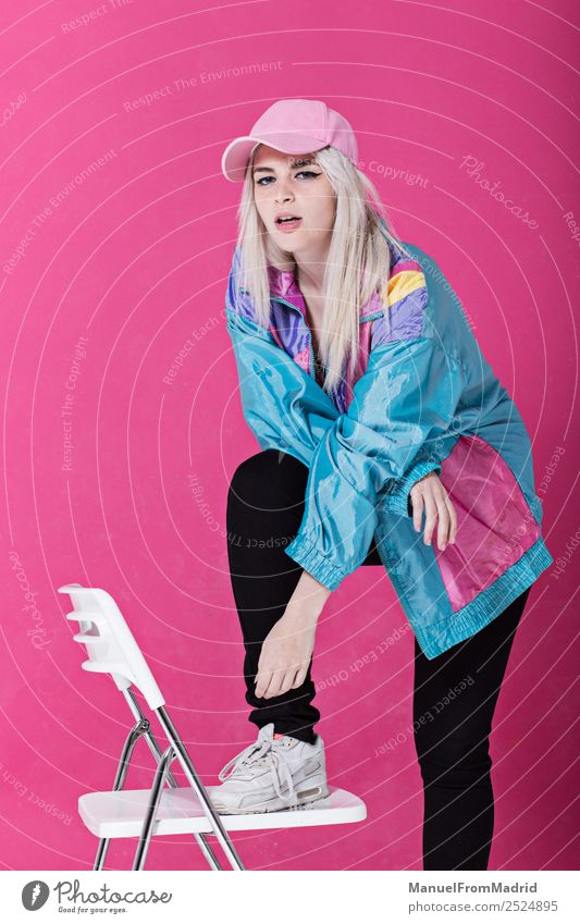 Stylish young woman posing Lifestyle Style Beautiful Make-up Chair Woman Adults Fashion Clothing Retro Crazy Cool (slang) 80s pink background swag Lean teenager