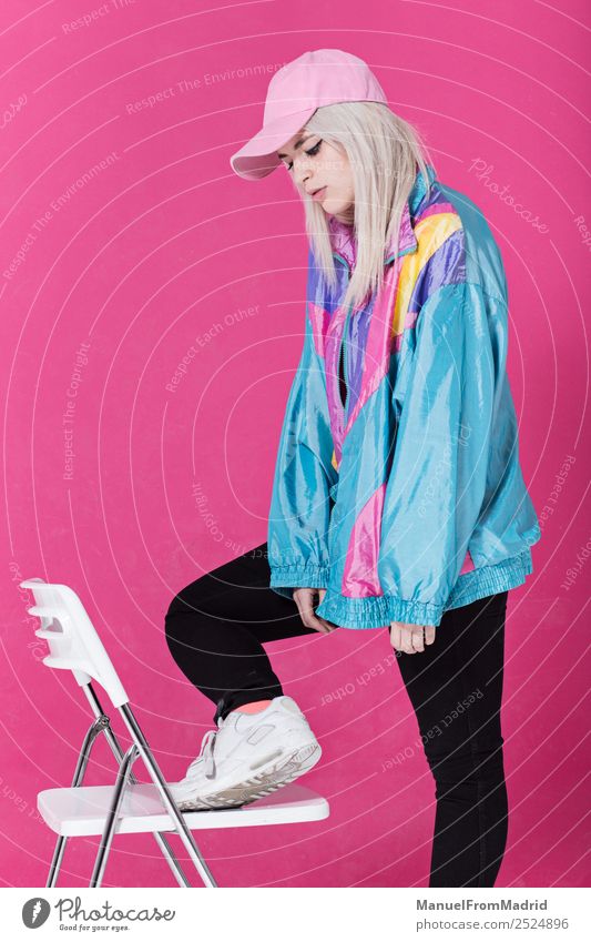 Stylish young woman posing Lifestyle Style Beautiful Make-up Chair Woman Adults Fashion Clothing Retro Crazy Cool (slang) 80s pink background swag Lean teenager