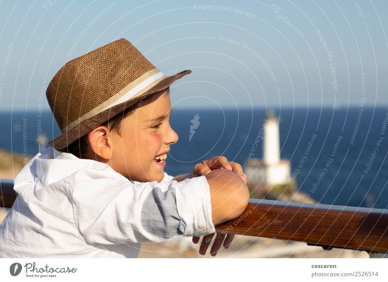 Little kid looking at sea from the railing of a cruise Lifestyle Joy Happy Beautiful Vacation & Travel Cruise Summer Sun Beach Ocean Child Human being Masculine