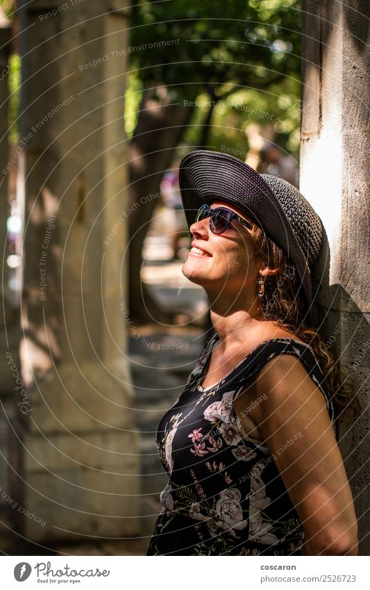 Woman leaning against a column with sunbeams on her face Lifestyle Style Happy Beautiful Skin Face Vacation & Travel Summer Sun Human being Feminine Adults 1