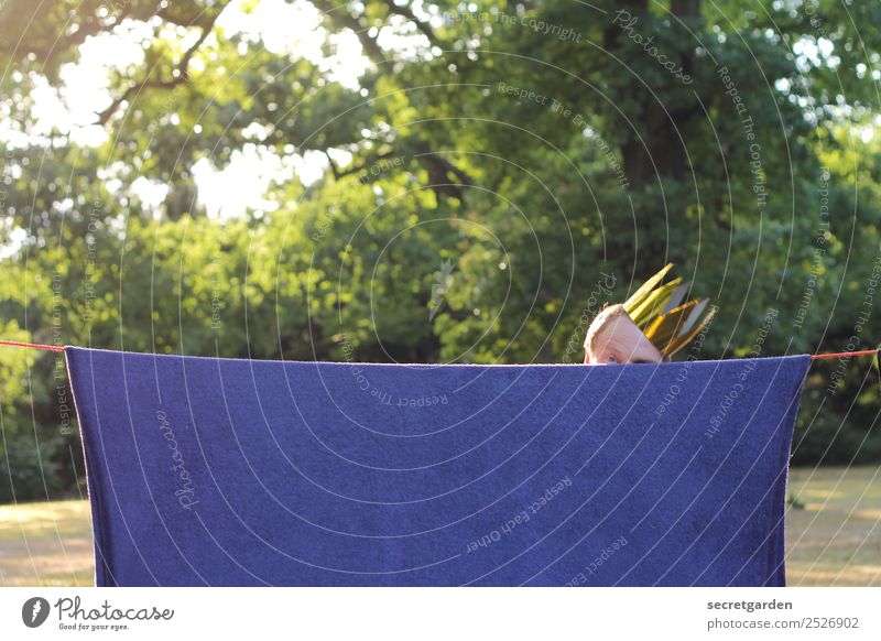 Man with crown hidden behind hanging carpet Playing Summer Masculine Adults Head 1 Human being 30 - 45 years Stage play Shows Beautiful weather Tree Garden Park