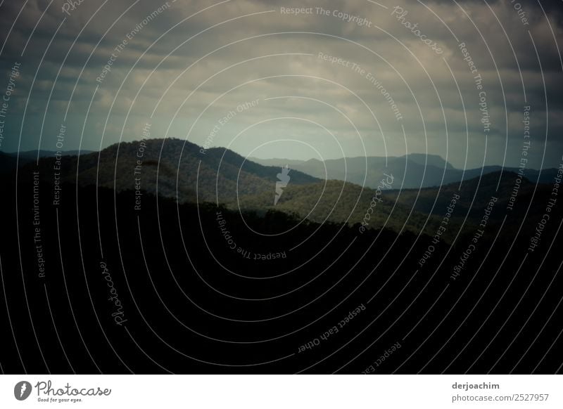 Evening mood in the mountains - Only a small bright glow with many clouds in front of dark mountain tops. Environment Nature Landscape Summer Beautiful weather