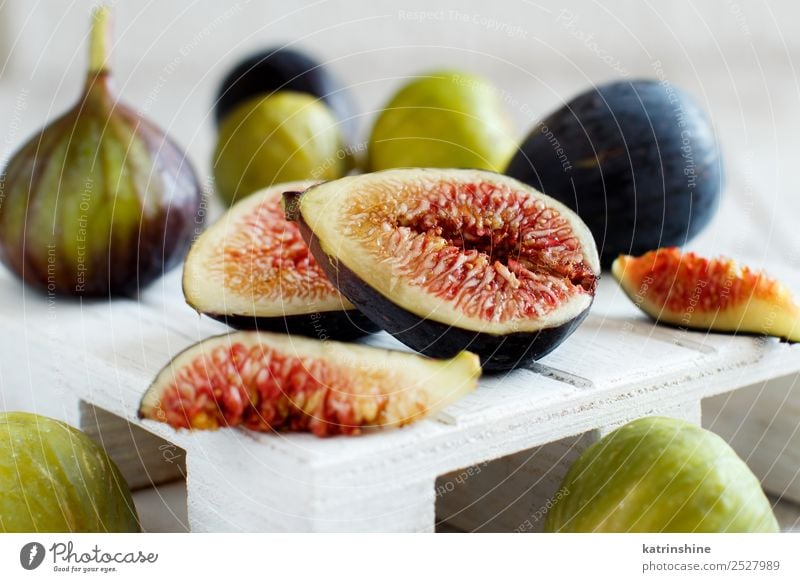 Fresh purple and green figs Fruit Dessert Vegetarian diet Diet Exotic Summer Autumn Wood Delicious White Fig food Organic Purple Mature seed Slice sweet Vitamin