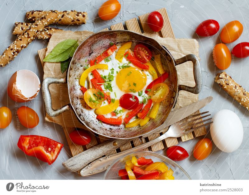 Fried egg with a bell pepper and tomatoes Vegetable Breakfast Pan Table Fresh Bright Yellow Red Cholesterol Cooking fat food Frying Fried egg sunny-side up Meal