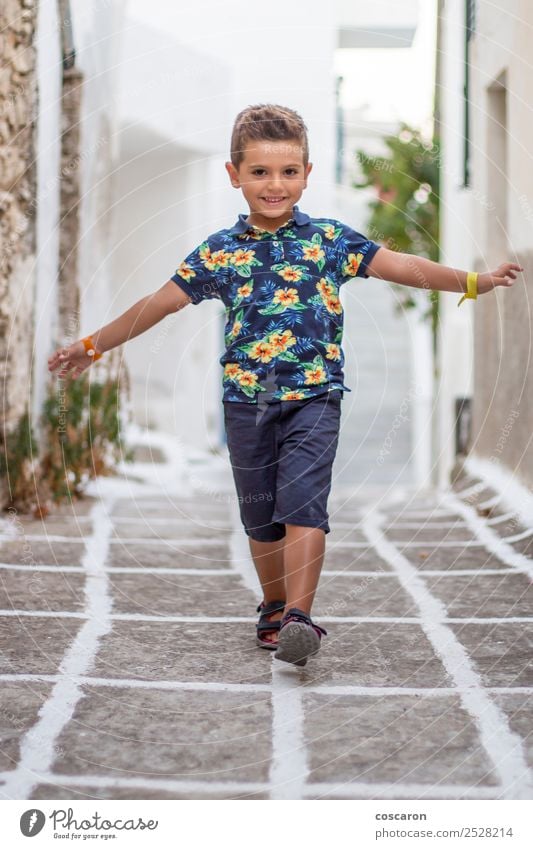 Little cute child doing balance on the street of a Greek village Lifestyle Design Joy Vacation & Travel Island Child Human being Masculine Toddler Boy (child)