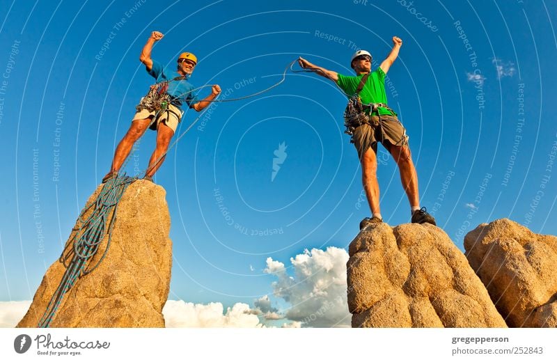 Rock climbing team standing on the summit. Sports Climbing Mountaineering Success Rope Man Adults 2 Human being 30 - 45 years Peak Helmet Athletic Enthusiasm