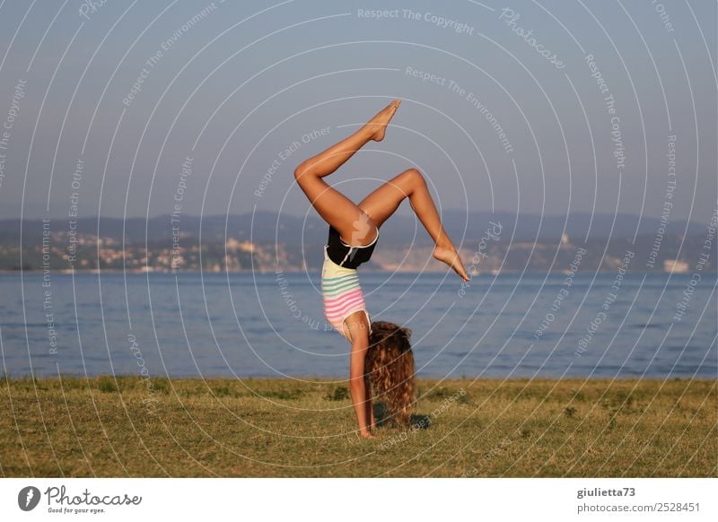 Yoga handstand at the beach Feminine Girl Young woman Youth (Young adults) Life 1 Human being 8 - 13 years Child Infancy 13 - 18 years Summer Meadow Beach Ocean