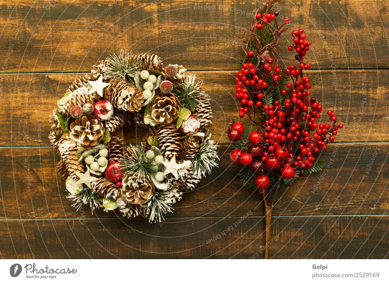 Delicate Christmas wreath of pine cones on wooden background Fruit Apple Luxury Design Winter Snow Decoration Feasts & Celebrations Christmas & Advent Autumn