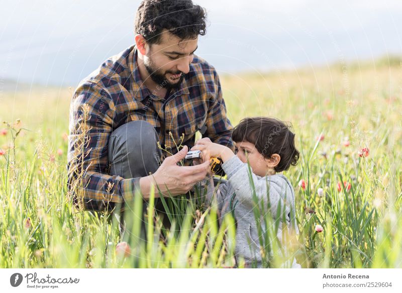 Car playing Lifestyle Playing Man Adults Parents Father Family & Relations 2 Human being 1 - 3 years Toddler 30 - 45 years Flower Grass Toys Together