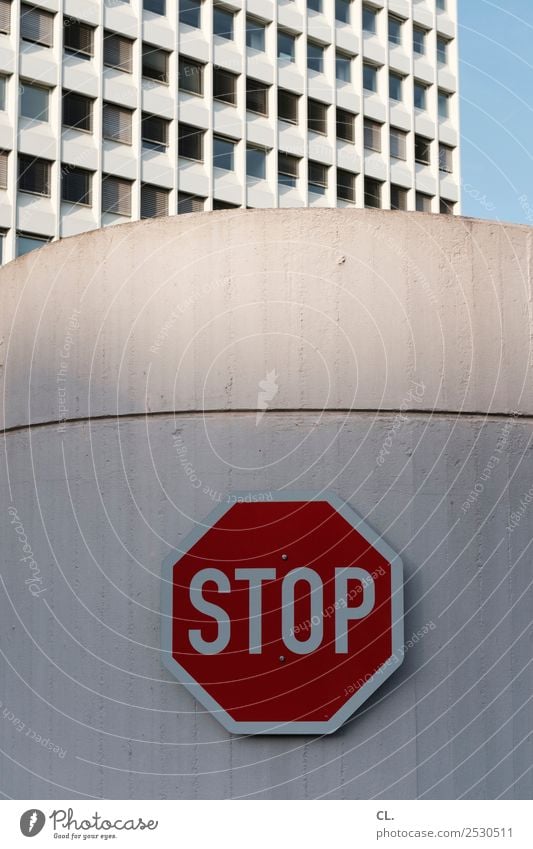 STOP Cloudless sky Town Downtown Deserted High-rise Manmade structures Building Architecture Wall (barrier) Wall (building) Facade Transport