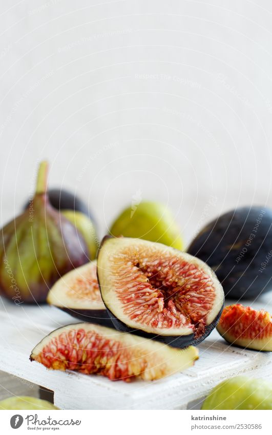 Fresh purple and green figs Fruit Dessert Vegetarian diet Diet Exotic Summer Autumn Wood Delicious White Fig food Organic Purple Mature seed Slice sweet Vitamin