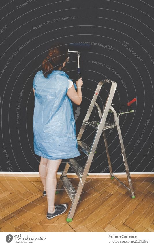 Woman in protective clothes coloring a wall with a paint roller Leisure and hobbies Feminine Adults 1 Human being 18 - 30 years Youth (Young adults)