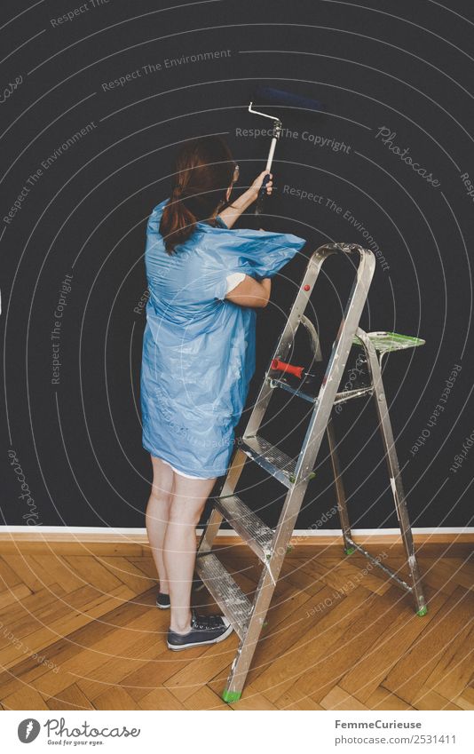 Woman in protective clothes coloring a wall with a paint roller Leisure and hobbies Feminine Adults 1 Human being 18 - 30 years Youth (Young adults)