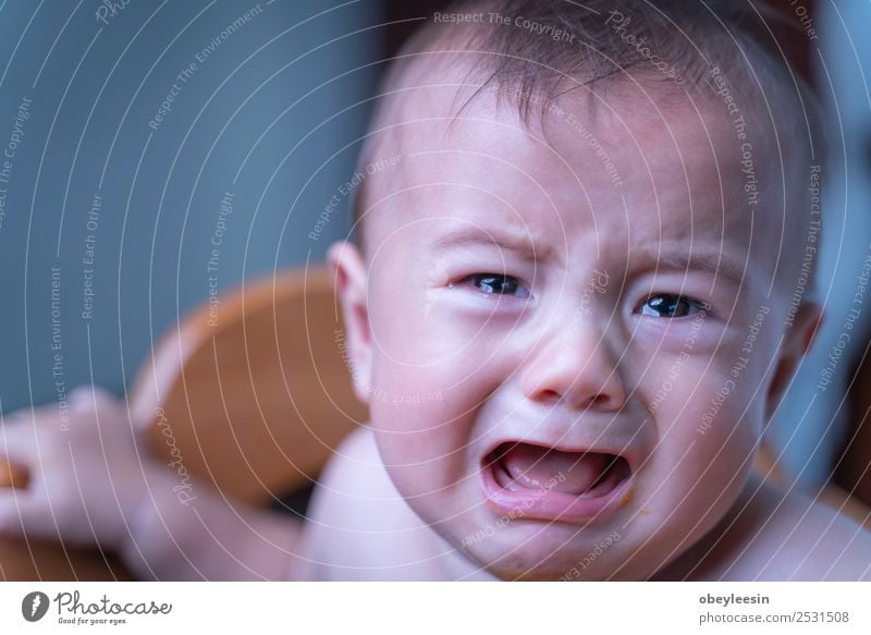 baby sitting sad and crying in the room Lifestyle Human being Head Face Eyes 1 0 - 12 months Baby Sit Colour photo