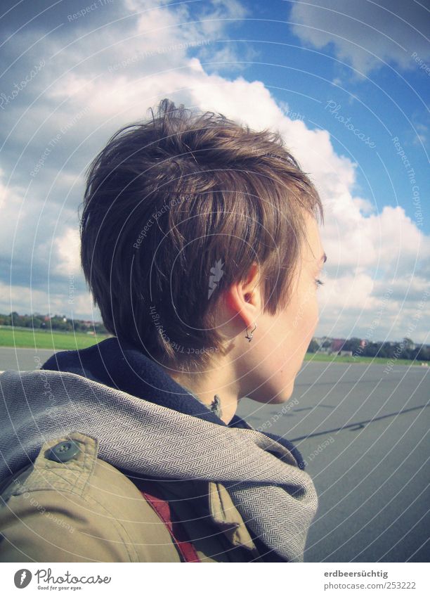 Flying lesson for thoughts - woman looks down on airport runway Aviation Young woman Youth (Young adults) Life Head Hair and hairstyles 1 Human being Sky Clouds