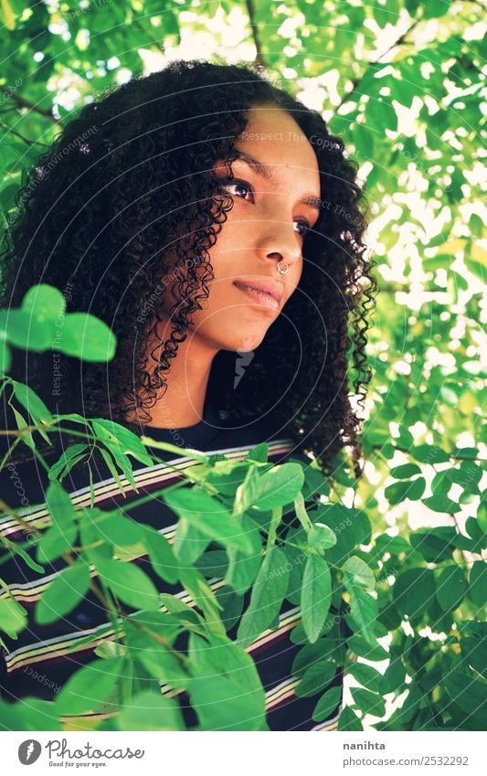 Young woman surrounded by green leaves Lifestyle Style Design Beautiful Hair and hairstyles Skin Face Human being Feminine Youth (Young adults) 1 18 - 30 years