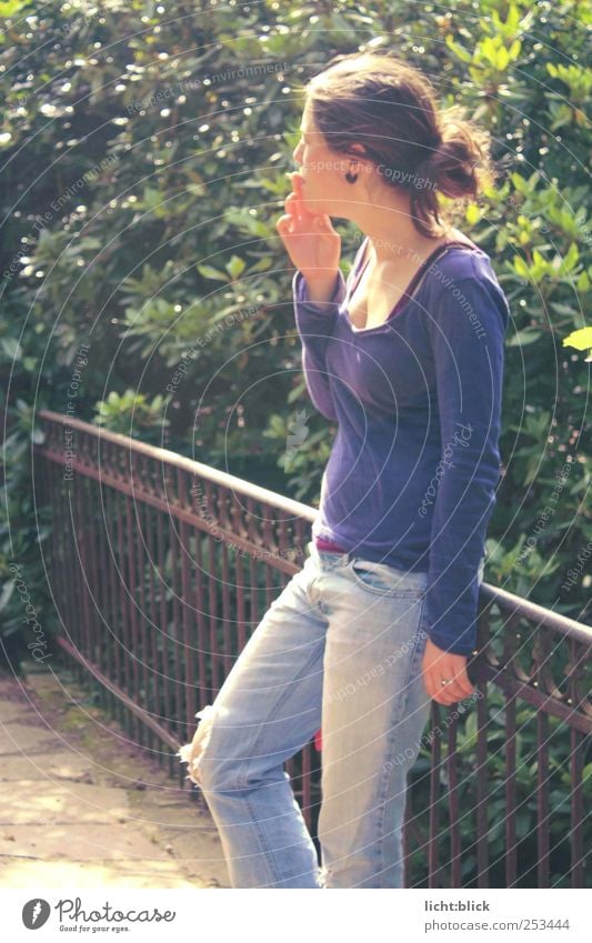 Serenity. Smoking Relaxation Feminine Young woman Youth (Young adults) 1 Human being 18 - 30 years Adults Bridge Bridge railing Jeans T-shirt Think Blue Violet