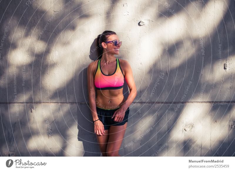 fit cheerful woman standing outdoors Lifestyle Body Music Woman Adults Fitness Smiling Stand Athletic Bright Joy Happiness Self-confident Optimism Success